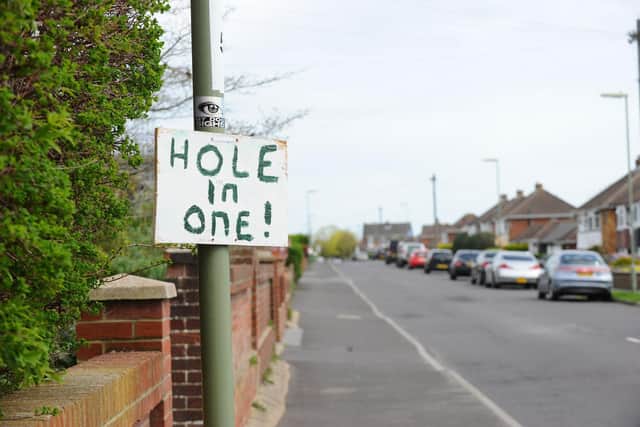 There have been signs referring to golf popping up down Portsview Avenue in Portchester, after residents have become angry with the amount of potholes in the road.

Picture: Sarah Standing (080424-7093)