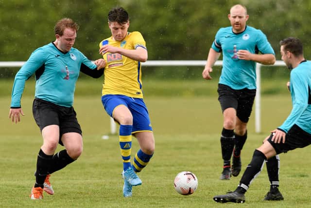 Meon's Bayley Whitcombe (yellow). Picture: Keith Woodland