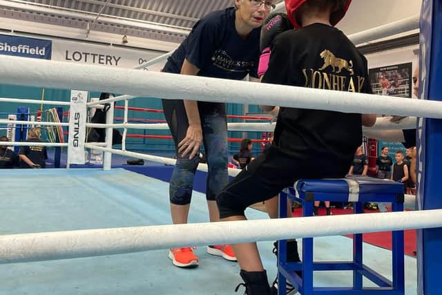 Joanne Seward talking to one of her students during a break