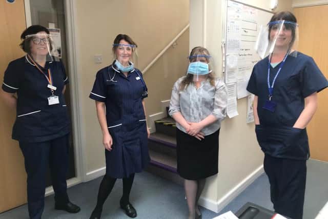 GP staff wearing the visors made by the 3D printing community across Portsmouth. Picture: Enwezor Nzegwu