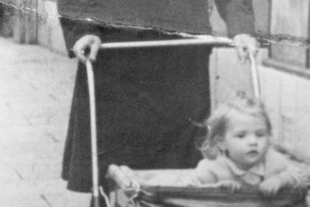 Pictured: Copy picture of Roy Downing when he was 23 in the Navy with his daughter, Joy.
