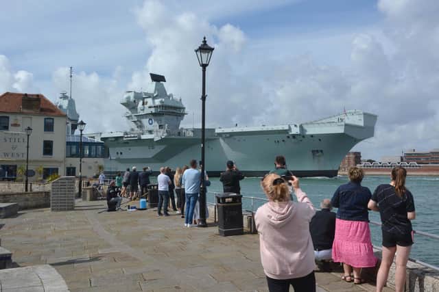 Royal Navy aircraft carrier HMS Prince of Wales approaches The Point as she returns to Portsmouth Naval Base Picture: Ben Mitchell/PA