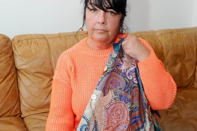 Grandmother-of-six Pauline Hopkins, 56, pictured in Baffins. Pauline with the shirt she was wearing on the night which has three missing buttons. Picture: Sarah Standing (130220-7509)