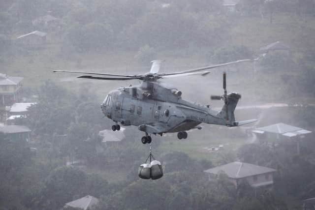 Currently the navy uses helicopters like the Merlin, pictured, to help deliver mail and supplies. By using drones, it's hoped it will save money in the long run and free up more helicopters for other missions.