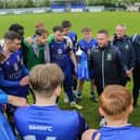 Baffins boss Danny Thompson speaks to his players after their Wessex League Cup final win over Petersfield in May 2023. Picture by Nathan Lipsham
