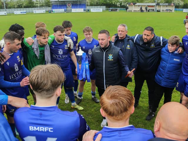 Baffins boss Danny Thompson speaks to his players after their Wessex League Cup final win over Petersfield in May 2023. Picture by Nathan Lipsham