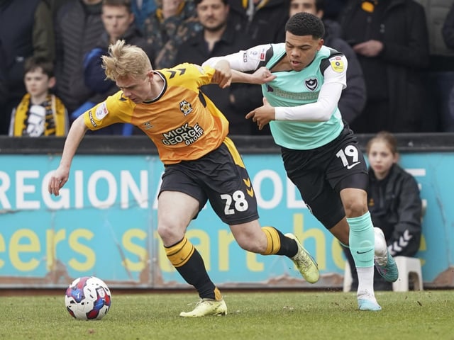Dane Scarlett pressures Cambridge United defender Liam Bennett in the first half of their Abbey Stadium clash. Picture: Jason Brown/ProSportsImages