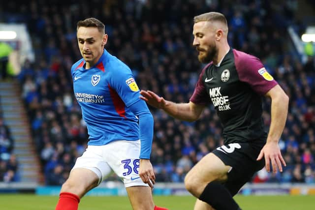 Dan Butler battles with Brandon Haunstrup during Peterborough's 2-2 draw at Pompey in December. Picture: Joe Pepler