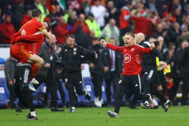 Joe Morrell celebrates Wales' first qualification for the World Cup finals since 1958. He will now be absent for a period of Pompey's 2022-23 campaign. Picture: Michael Steele/Getty Images