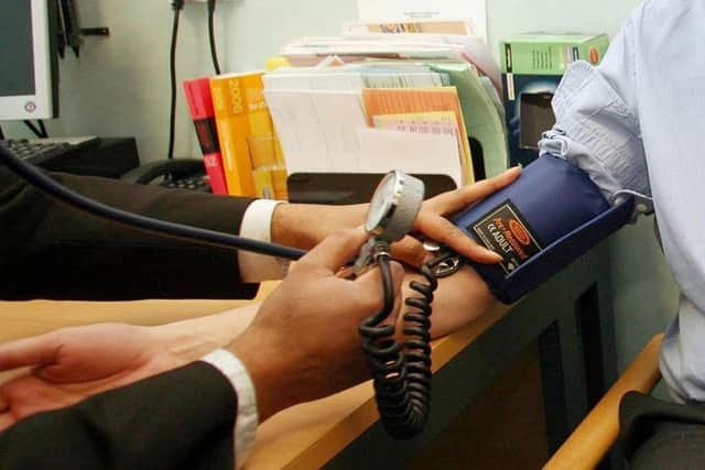 Lake Road Practice and Sunnyside Medical Centre have announced plans to merge later in the year. Photo is a stock image of a GP in action. Picture: Andrew Parsons/PA Wire