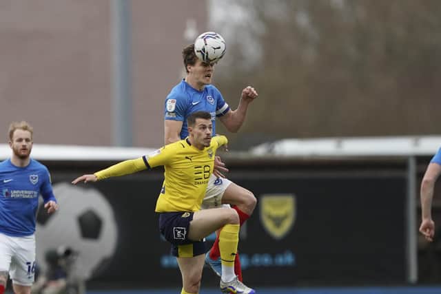 Sean Raggett rises to win the ball in Saturday's 3-2 defeat at Oxford United. Picture: Jason Brown/ProSportsImages