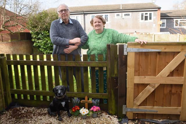 Pictured is: Teresa and Roy Johnson by Charlie's grave.
Picture: Keith Woodland (260221-12)