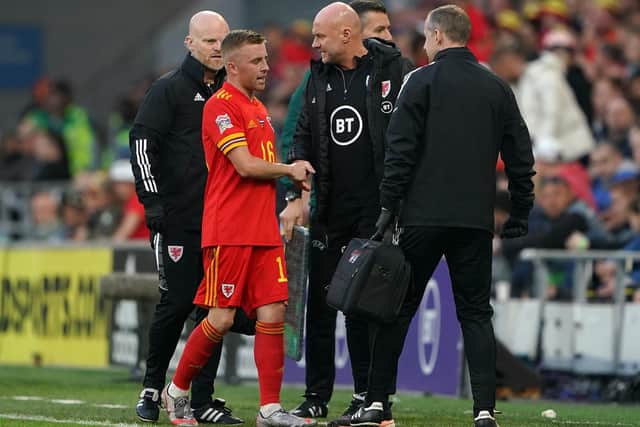 Joe Morrell leaves the field against Holland after fracturing his toe on international duty for Wales. Picture: Zac Goodwin/PA Wire