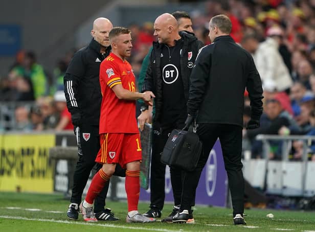 Joe Morrell leaves the field against Holland after fracturing his toe on international duty for Wales. Picture: Zac Goodwin/PA Wire