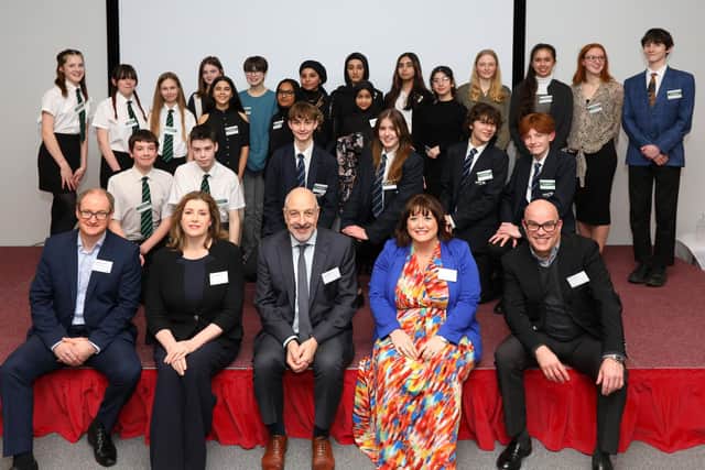 The Dragons, sitting from front left, James Sessions of Prysmian Group, Penny Mordaunt MP, Huw Chapman of PETA Ltd, Kelly Sunderland of PEI-Genesis UK Ltd and Tony Mason of PALL corporation, and the contestants. Awards evening at PETA in Northarbour Rd, Portsmouth, where teams of schoolchildren from across the city were pitted against an expert panel, in a Dragon's Den style contest
Picture: Chris Moorhouse (jpns 110222-19)