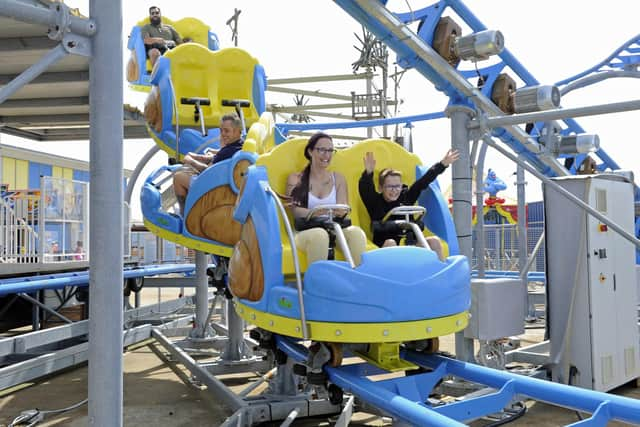 A family enjoys one of the roller coasters at Clarence Pier 
Picture Ian Hargreaves (180720-6)