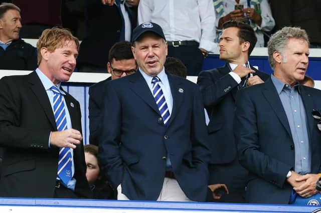 Pompey chairman Michael Eisner, centre, with son Eric, left, and Will Farrell