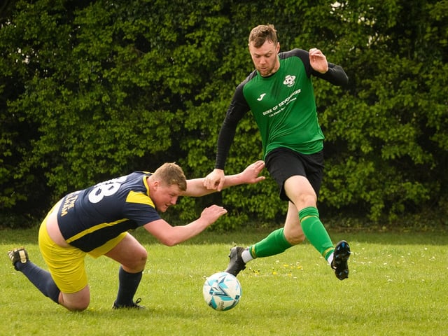 Action from Saturn Royale's 1-0 win over Pelham Arms (blue and yellow kit) in the second Adelaide Cup semi-final. Picture: Keith Woodland (300421-536)