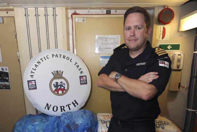 Commander Chris Hollingworth of the Royal Navy with the seized contraband from the HMS Medway drugs bust Picture: LPhot Gareth Smith/MOD/Crown Copyright/PA Wire
