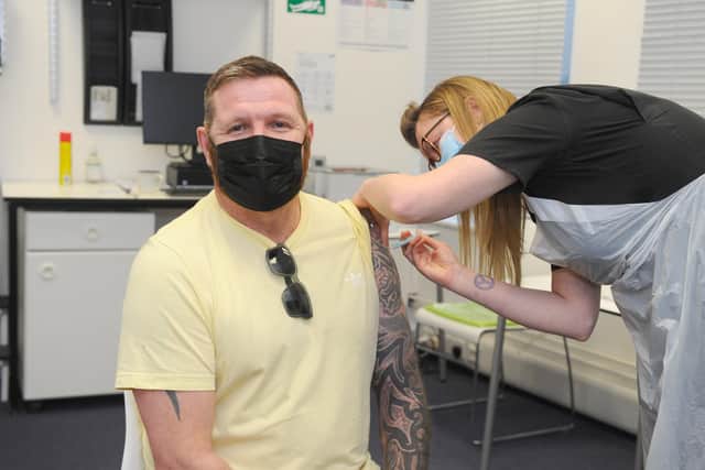 More than two million vaccines have been given out in Hampshire and the Isle of Wight.

Pictured is: Dean Fitzgerald (47) from Hilsea getting his vaccine at Lalys Pharmacy in Portsmouth.

Picture: Sarah Standing (220421-7039)