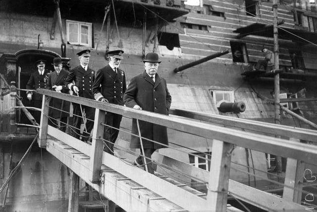 February 1925:  William Clive Bridgeman, First Lord of the Admiralty, on the gangway of HMS Victory during an inspection of the dockyards at Portsmouth.  He is accompanied by the Commander-in-Chief and the Admiral Superintendent.  (Photo by Brooke/Topical Press Agency/Getty Images)