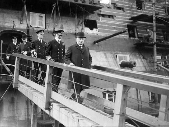 February 1925: William Clive Bridgeman, First Lord of the Admiralty, on the gangway of HMS Victory during an inspection of the dockyards at Portsmouth. He is accompanied by the Commander-in-Chief and the Admiral Superintendent. (Photo by Brooke/Topical Press Agency/Getty Images)