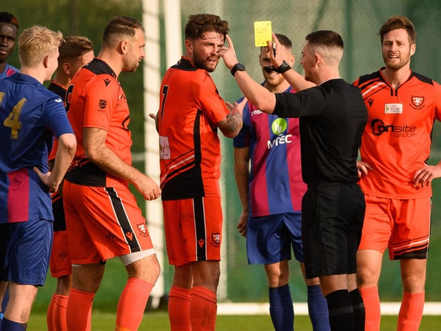 Portchester's James Cowan is booked. Picture: Keith Woodland