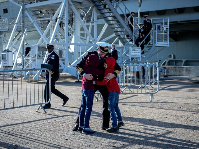 Commanding Officer Captain Richard Hewitt OBE with his children Oliver, 10 and William, eight.