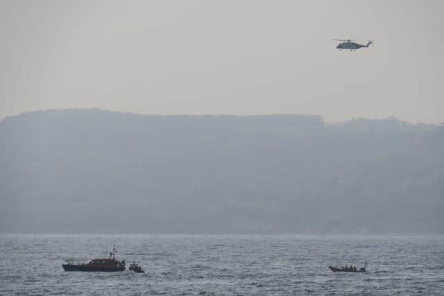 The rescue operation involved the RNLI, coastguard and Royal Navy