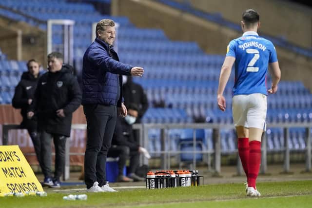 Karl Robinson laughs with Callum Johnson