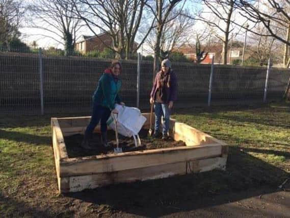 Rebecca Hull (left) and daughter Phoebie Hull working on the Elson Junior School allotment.