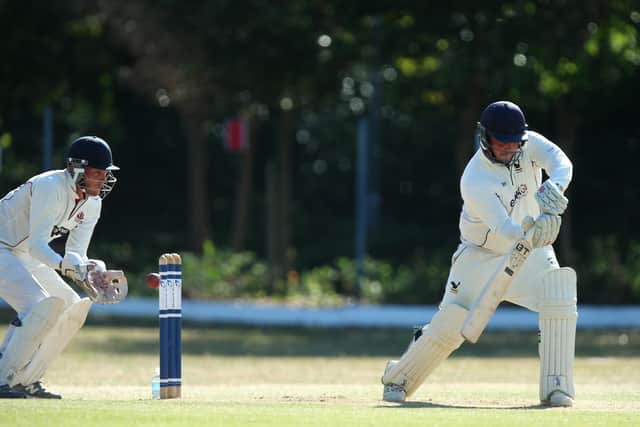 Purbrook's Brad Mengham is about to be caught behind by Portsmouth & Southsea wicket-keeper Matt Benfield. Picture: Chris Moorhouse