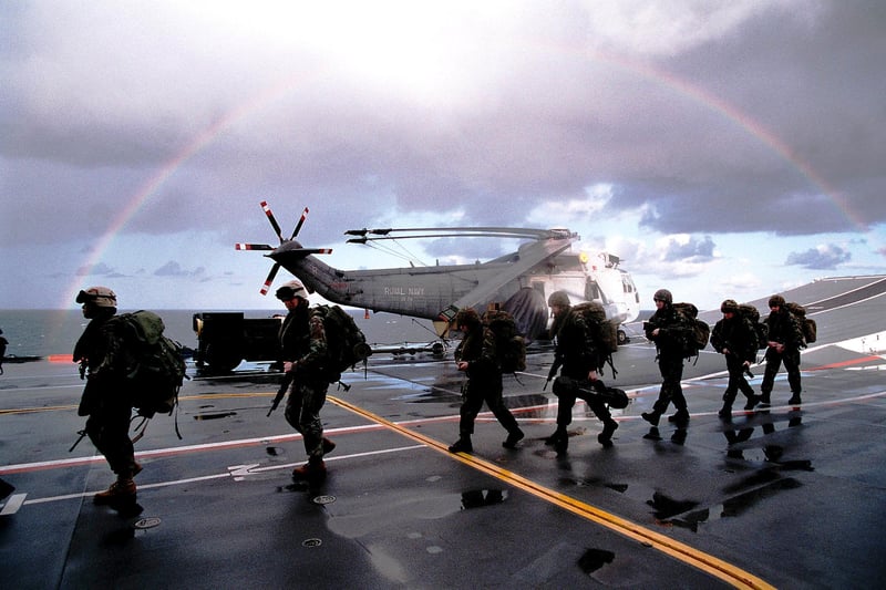 Members of close combat troop from Delta Company 40 Commando Royal Marines preparing to board CH 47 Chinook aboard HMS Ark Royal during NTG 03.Picture: LA (PHOT) SEAN CLEE COMATG (PHOT)