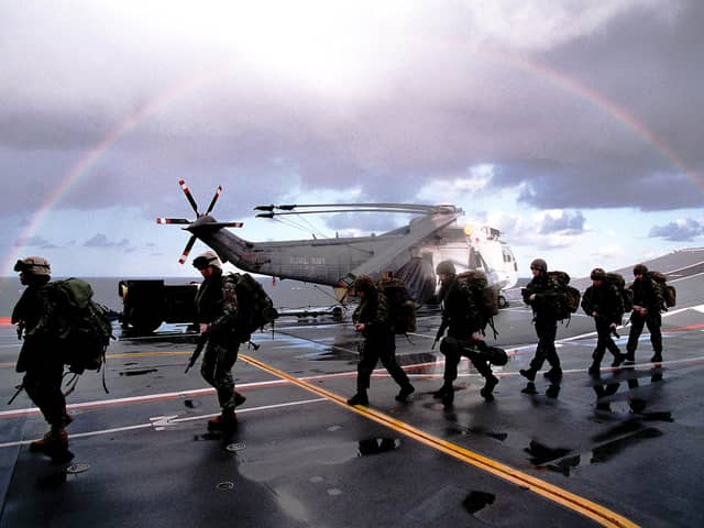 Members of close combat troop from Delta Company 40 Commando Royal  Marines preparing to board CH 47 Chinook aboard HMS Ark Royal during NTG 03.Picture: LA (PHOT) SEAN CLEE COMATG (PHOT)