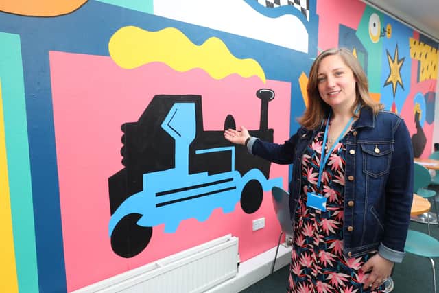 Sophie Fullerlove pictured with the mural. Picture: Stuart Martin (220421-7042)