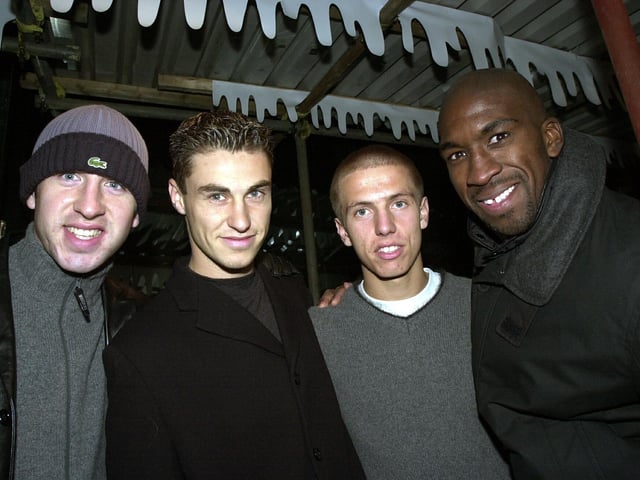 Pictured: Pompey football heroes (left to right), Shaun Derry, Mike Panopoulos, Gary O'Neil and Darren Moore enjoy the Christmas lights switch on at Commercial Road in Portsmouth.
