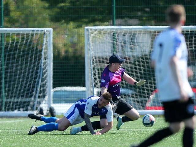 Clanfield keeper Ashley Wright was booked for this foul. Picture: Chris Moorhouse