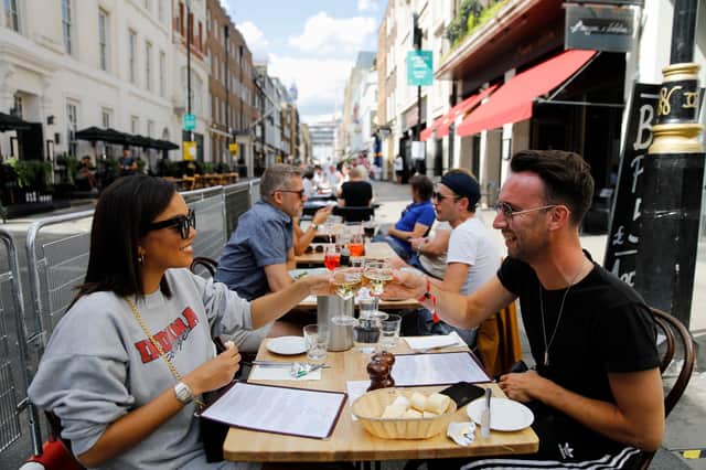 Diners taking advantage of the Government's Eat out to Help out scheme. Photo by TOLGA AKMEN/AFP via Getty Images.