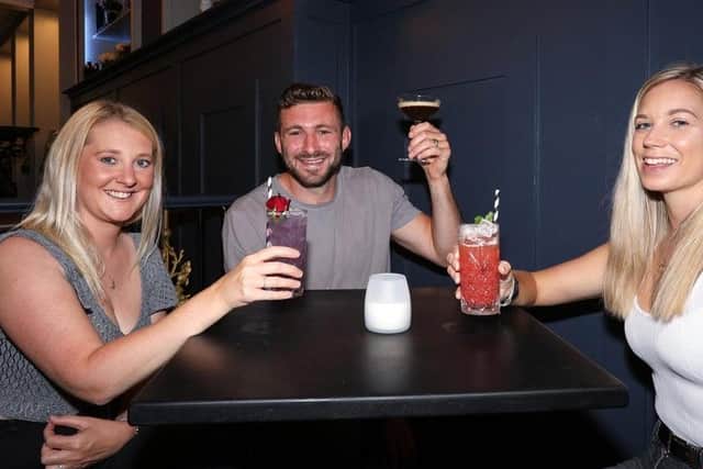Punters at the Monarch pub in Palmerston Road toast the re-opening of pubs in July.