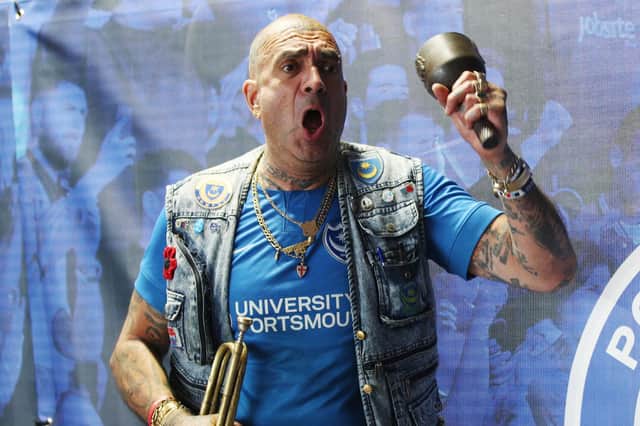 Portsmouth fan John Westwood shows his support outside the ground during the match. Picture: Joe Pepler