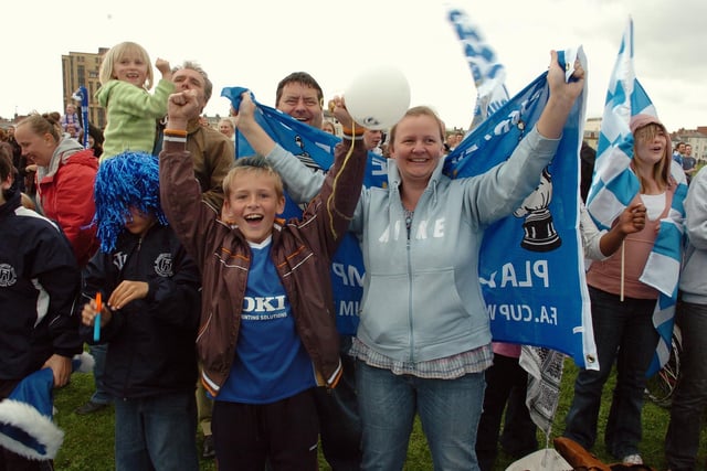 Jack Rosser from Southsea with his mum Wendy celebrate Kanu's winnerPICTURE: MALCOLM WELLS