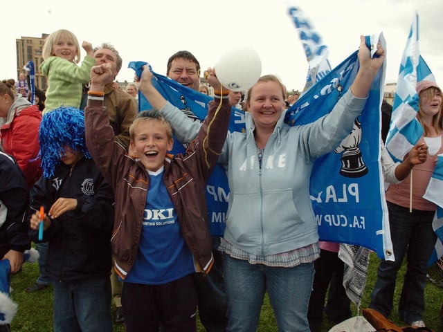 Jack Rosser from Southsea with his mum Wendy celebrate Kanu's winnerPICTURE: MALCOLM WELLS
