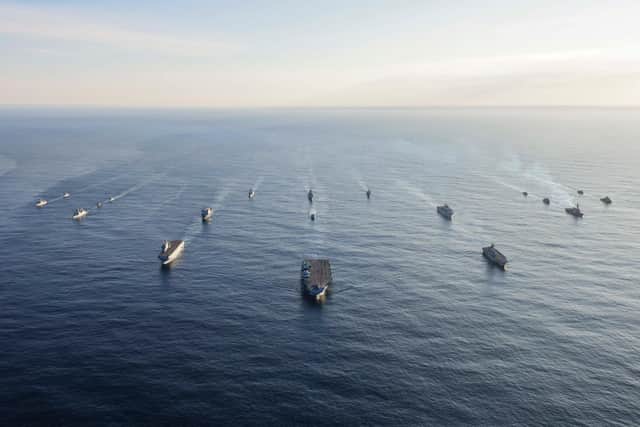 Front and centre: HMS Prince of Wales leads a huge Nato armada in war game near Norway.
