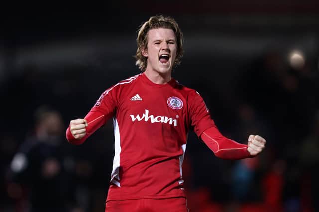 Tommy Leigh celebrates Accrington's victory over Boreham Wood that set up tomorrow's FA Cup visit of Leeds  United. Photo by George Wood/Getty Images