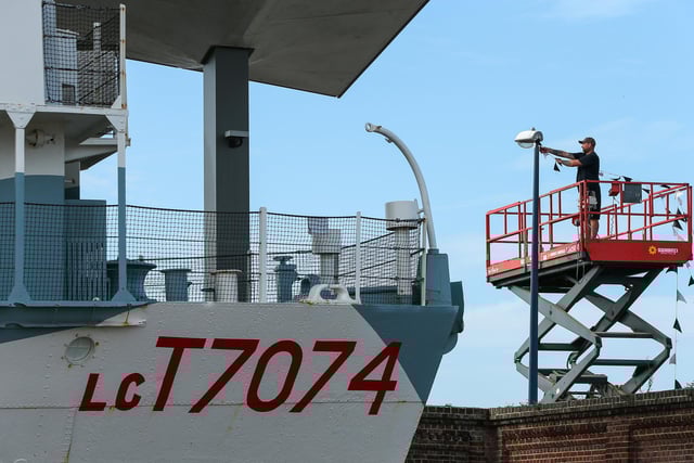 Bunting is removed near the D-Day Story LC T7074 landing craft. Site clearance after Victorious, Southsea Common Picture: Chris  Moorhouse (280824-017)