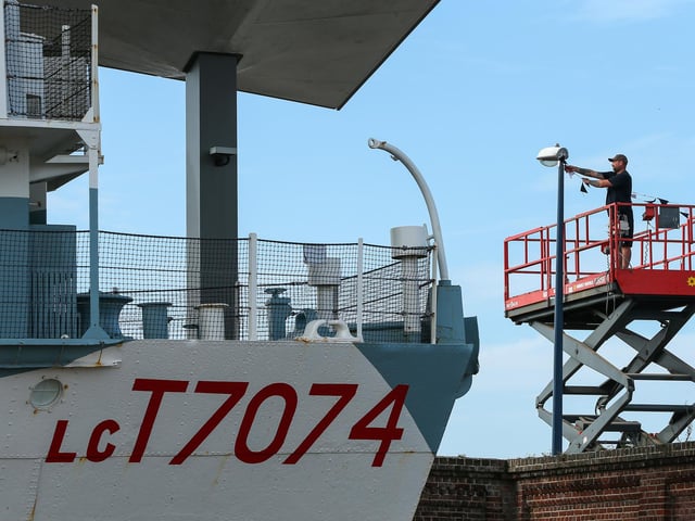 Bunting is removed near the D-Day Story LC T7074 landing craft. Site clearance after Victorious, Southsea Common Picture: Chris Moorhouse (280824-017)