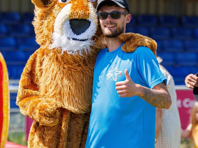 Title: Recfest Pictured: one of the coaches with mascot lion