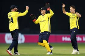 James Vince celebrates with Ben McDermott after Hampshire had taken a Glamorgan wicket last night. Photo by Ryan Hiscott/Getty Images