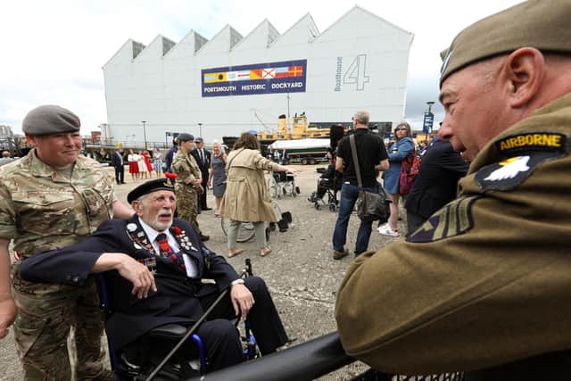 Joe Cattini chats with a re-enactor D-Day veterans come ashore in a landing craft at Portsmouth HIstoric Dockyard to mark the 77th anniversary of the decisive wartime event in June 2021. 
Picture: Chris Moorhouse (jpns 060621-15)