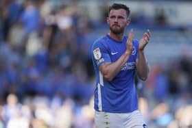 Pompey midfielder Ryan Tunnicliffe applauds the Fratton faithful after another impressive showing.